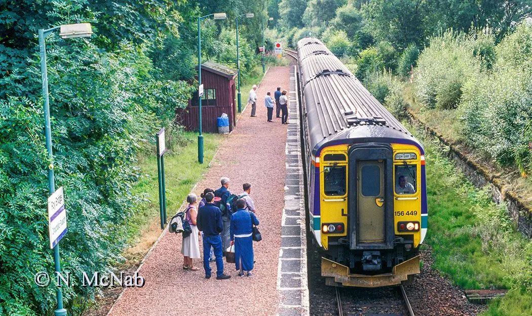 Roy Bridge Station on the West Highland Line showing people on the platform extension