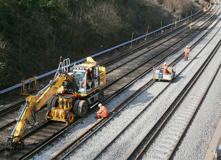 Digger renovating tracks