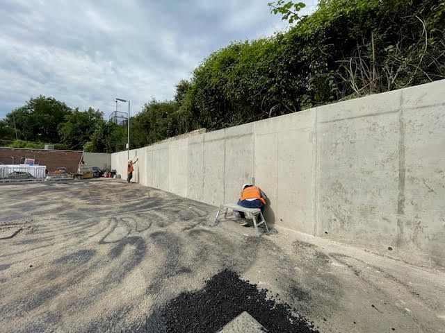 New retaining wall being built by railway for new Aldi store at Caterham