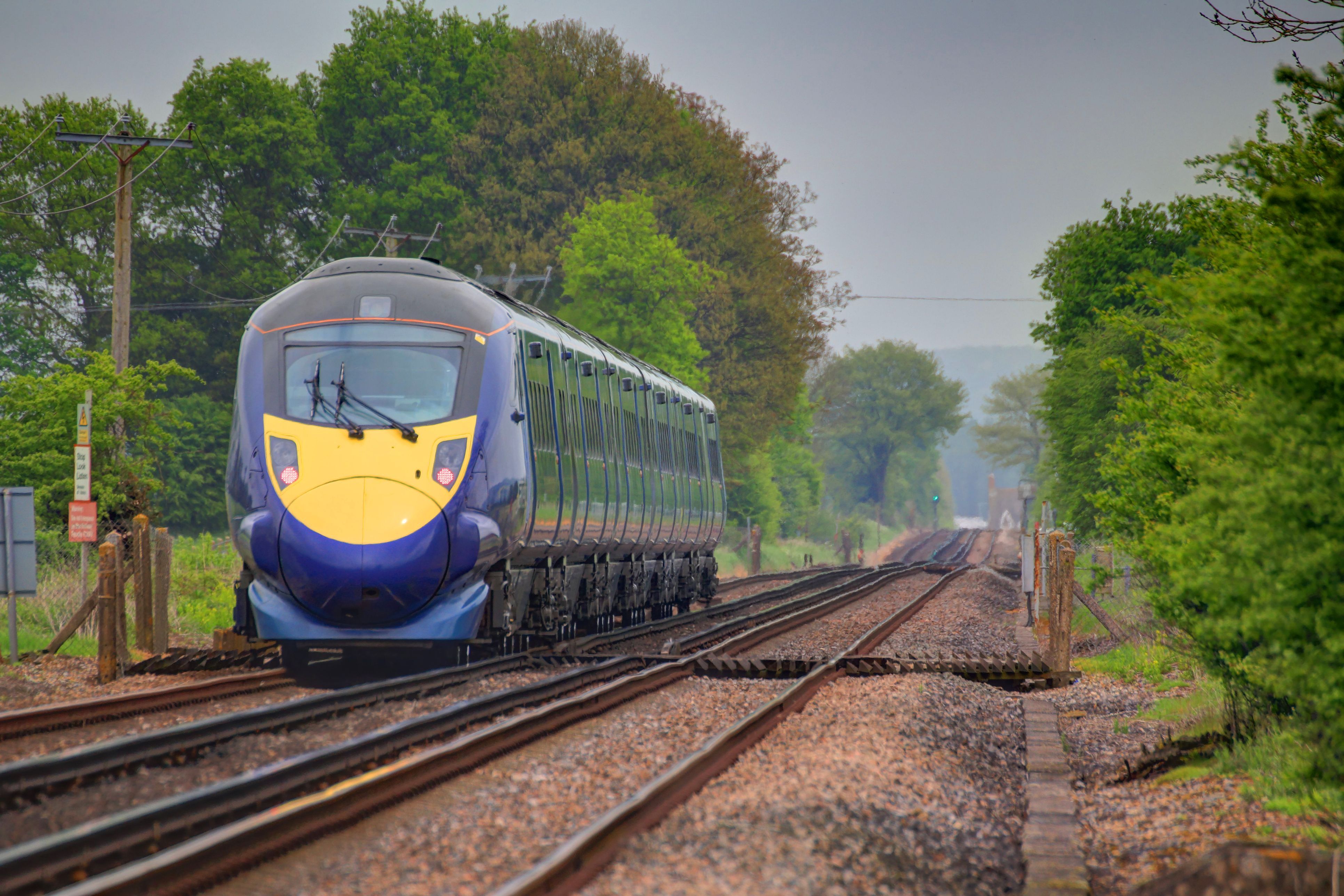 Blue train on railway line in the UK